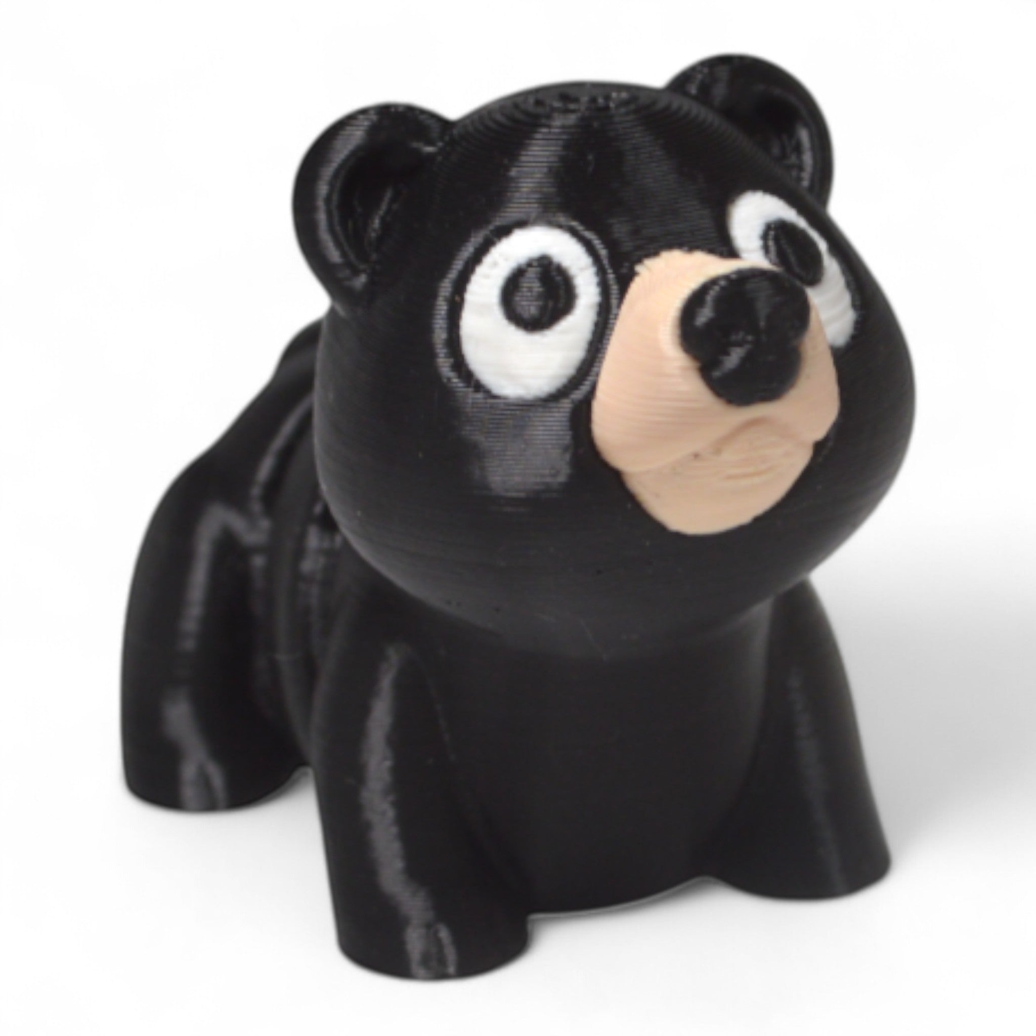 Siyah Cribbliz baby ayı figürü önden görünüm – sevimli yüz ifadesiyle hareketli oyuncak