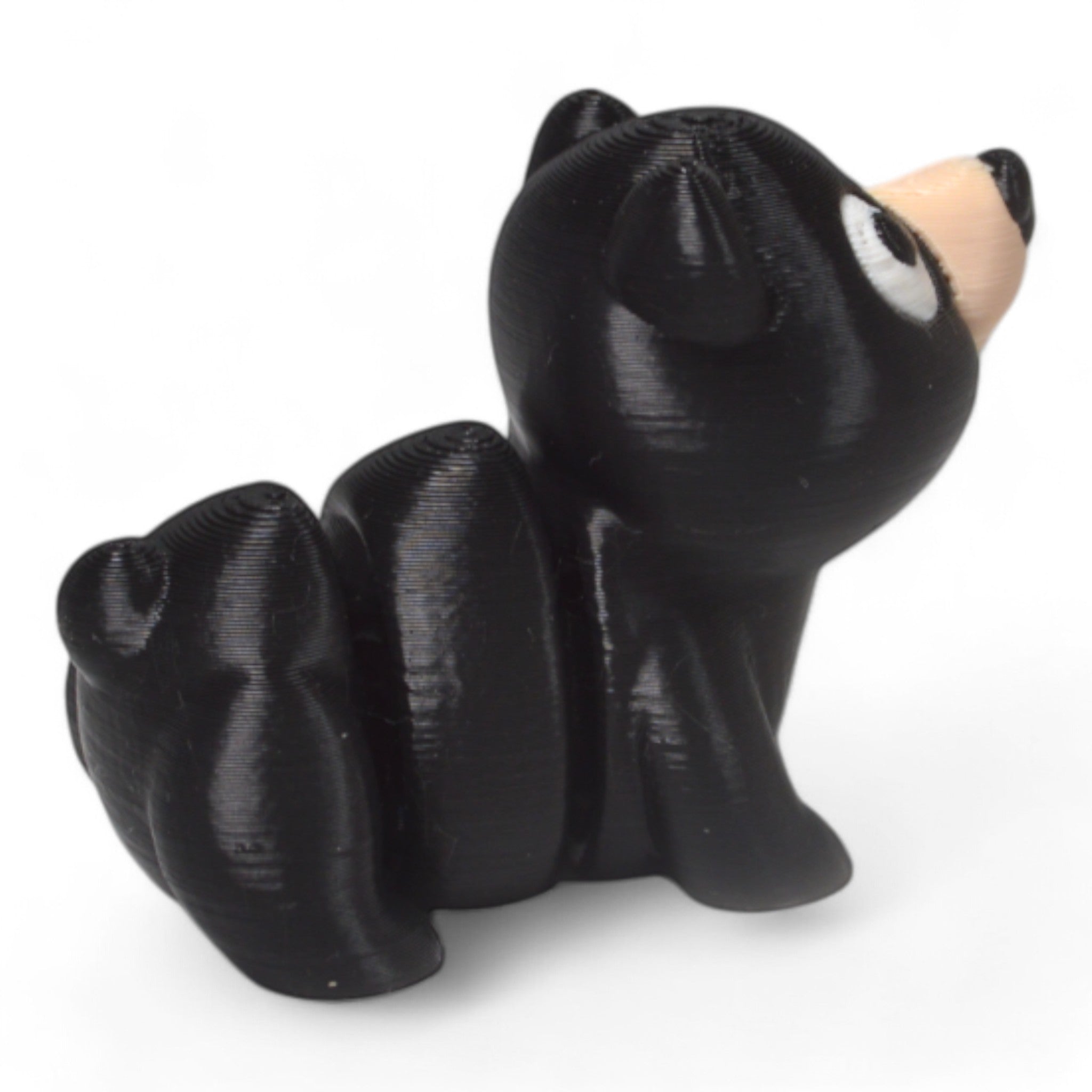 Yan açıdan siyah Cribbliz baby ayı figürü – küçük boyutlu ve eğlenceli çocuk oyuncağı