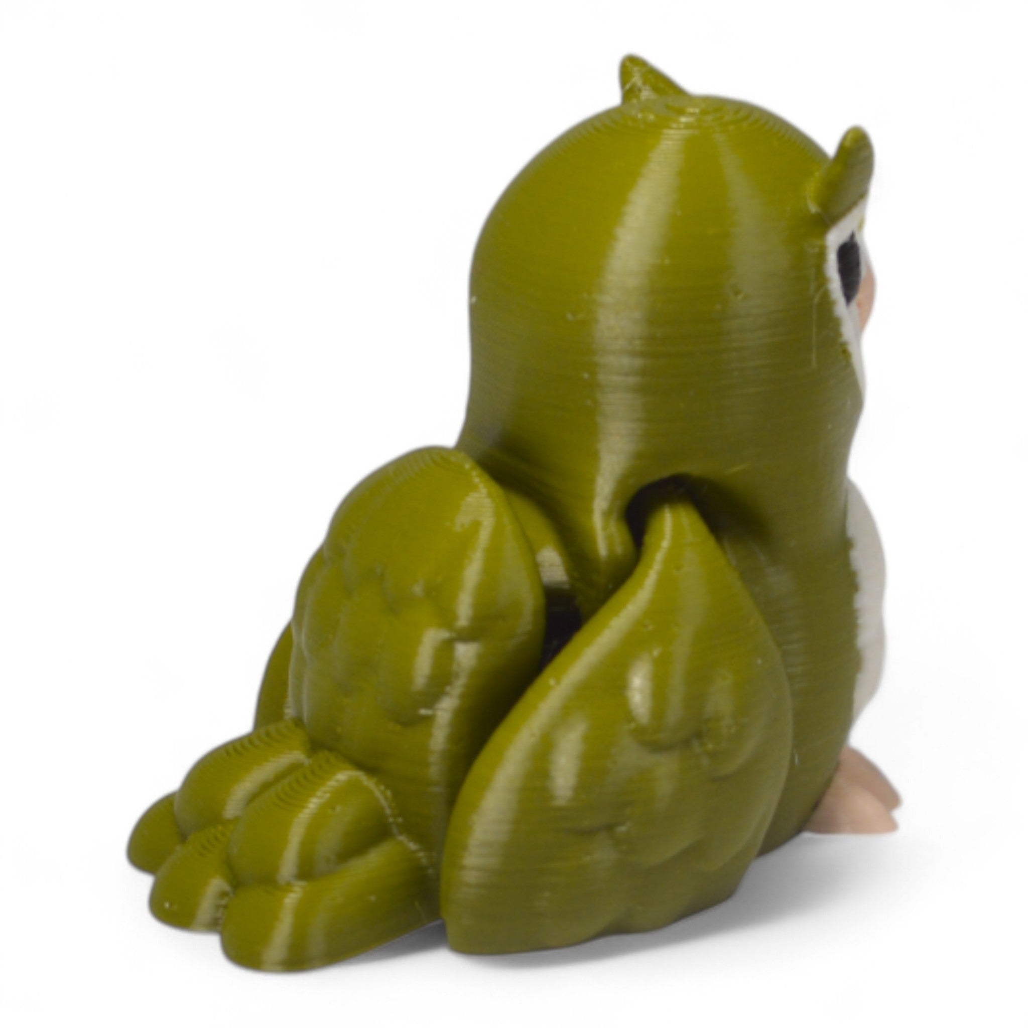 Arka görünümde yeşil Cribbliz baykuş figürü – kanat ve tüy detaylarıyla koleksiyonluk oyuncak