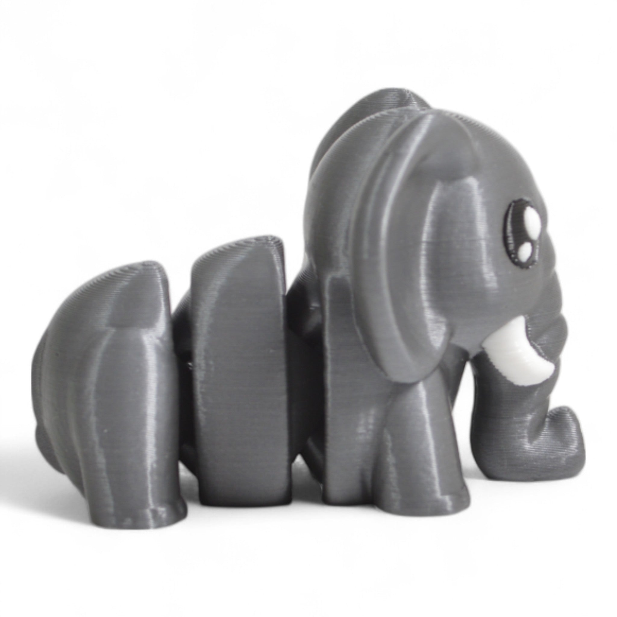 Yan açıdan gri Cribbliz fil figürü – minimal tasarımlı hareketli oyuncak